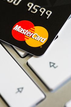 Benon, France - Feb 08, 2017: MasterCard credit card on keyboard, close up photo