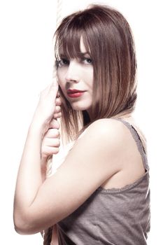 portrait of a beautiful girl holding on a rope