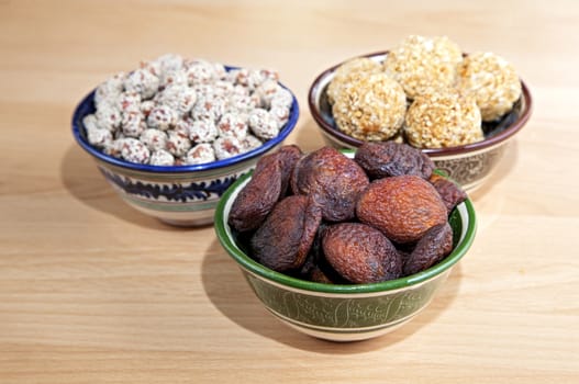 Oriental sweets in bowls on a table