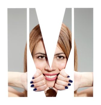 girl hiding behind and holding the letter "M"