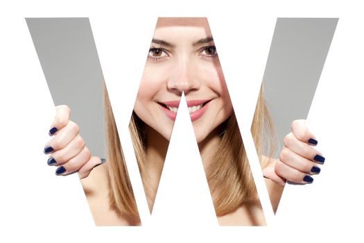 girl hiding behind and holding the letter "W"