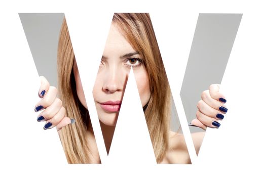 girl hiding behind and holding the letter "W"
