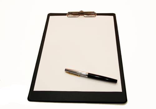 A white sheet of paper with a pen mounted on a black folder