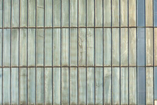 Silver-colored metal wall corrugated sheet metal background.