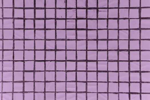 Texture of fine little ceramic tiles background. Pink floor tiles
