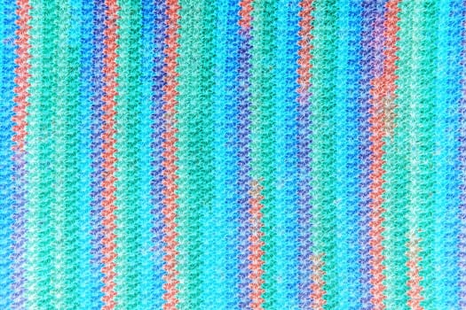 Colorful rainbow knitting background close up