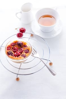 Clafoutis with berries and a cup of tea