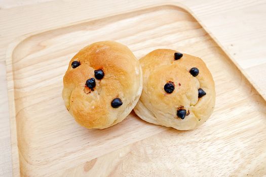Bread filled with Chocolate Chip in dish Wooden