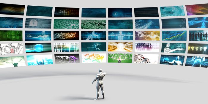 Man Pointing at a Video Wall Filled with Screens
