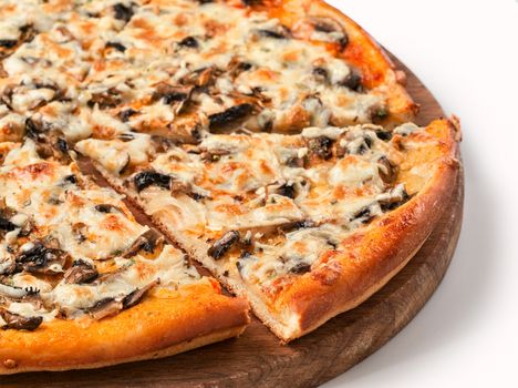 Close up view on piece of pizza with mushrooms and cheese on wooden cutting board. Isolated on white with clipping path