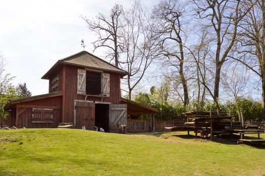 Stable and dovecote gathered on a small coast in a wildlife park in France