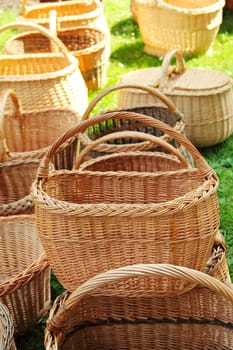 Many Wicker baskets in a street market on grass field