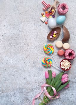 Assorted easter sweets, bakery cupcakes, chocolate eggs and confectionery 