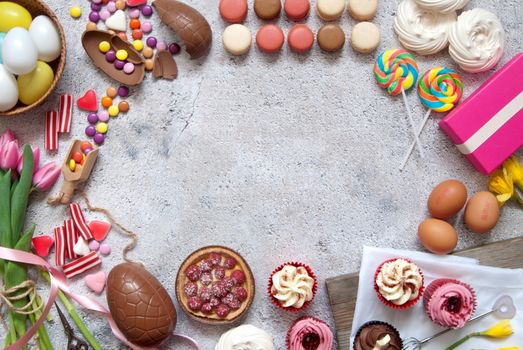 Assorted easter sweets, bakery cupcakes, chocolate eggs and confectionery 