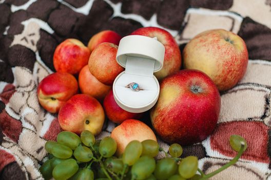 Engagement ring with a blue stone in a white box