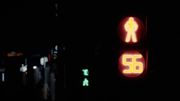 Close up of Moscow traffic light counting down in seconds on black background