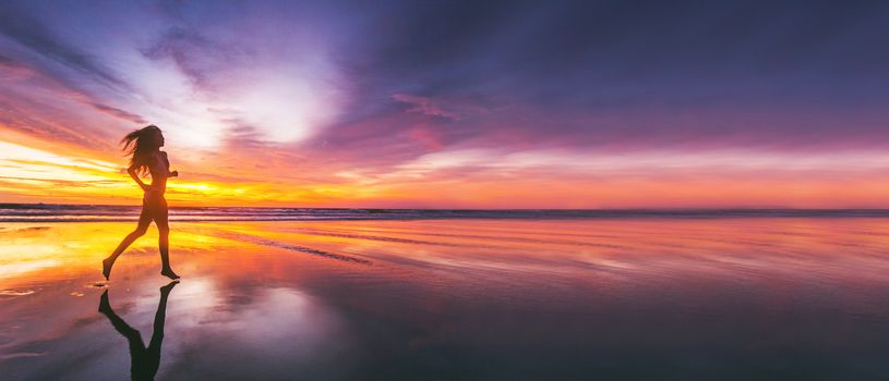 Woman running on the beach at sunset in bikini. Bali island, Indonesia