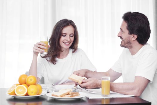 Couple having breakfast together at home 