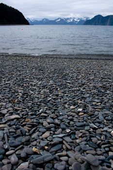 A beach made of smooth stones on Fox Island near Seward, Alaska. 
