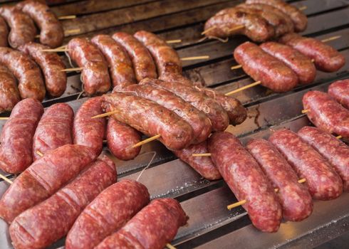 Cooking sausage at barbecue outdoor,Shallow depth of field.