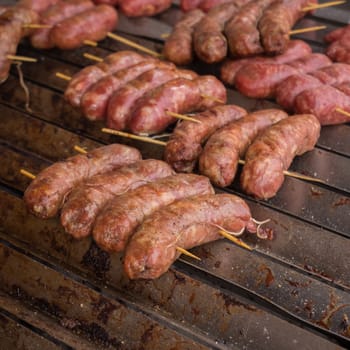 Cooking sausage at barbecue outdoor,Shallow depth of field.