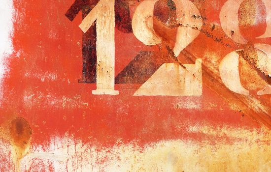 old rusty painted metal wall with numbers, wallpaper background                               