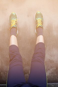 foot on the old concrete of wall with warming up.