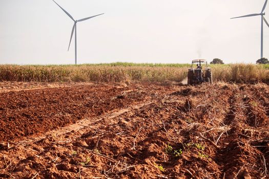 ground where the farmer is plowing soil for crops.