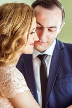 Close up portrait of happy husband and wife after the ceremony in a registry office in Lviv, Ukraine