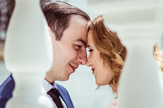 Portrait of happy man and woman at the registry office after the ceremony in Lviv, Ukraine