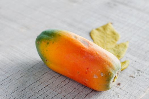 Papaya is ripe on the old wooden floor.