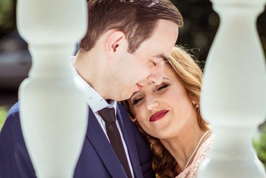 Portrait of happy man and woman at the registry office after the ceremony in Lviv, Ukraine