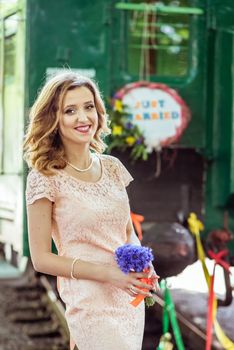 Portrait of bride near the last wagon in Lviv, Ukraine