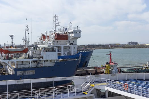 Ships are in port near the pier.