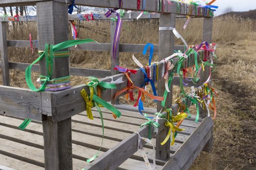 Bridge desires railing tied with colored ribbons.