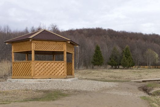 Open wood cabin in the woods.