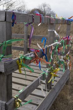 Bridge desires railing tied with colored ribbons.