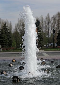 The gush of water of a fountain.