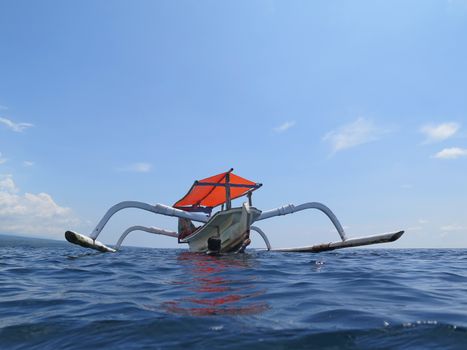 Traditional fishing boats floating on the sea Bali, Indonesia.