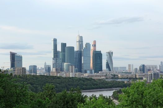 Modern buildings of glass and steel skyscrapers against the sky.