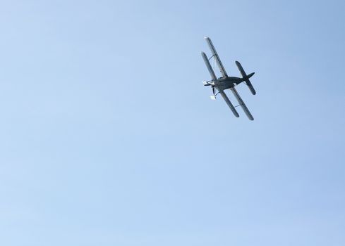 Biplane with skis instead of wheels against the sky