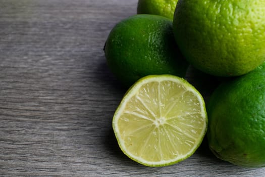 Group of limes in a wooden background