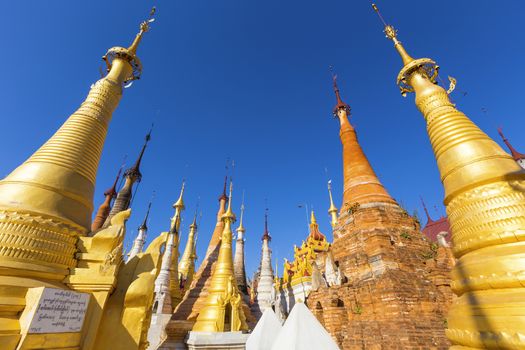 Ruins of ancient Burmese Buddhist pagodas Nyaung Ohak in the village of Indein on Inlay Lake in Shan State, Myanmar, Burma)