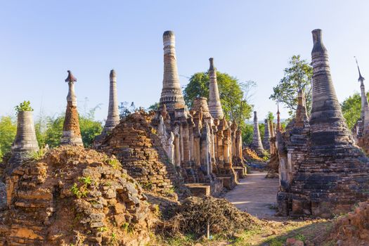 Ruins of ancient Burmese Buddhist pagodas Nyaung Ohak in the village of Indein on Inlay Lake in Shan State, Myanmar, Burma)