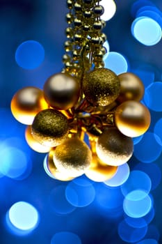 Blue Golden Ornaments. Golden Christmas Ornaments and Blue Background - Bokeh Lights.