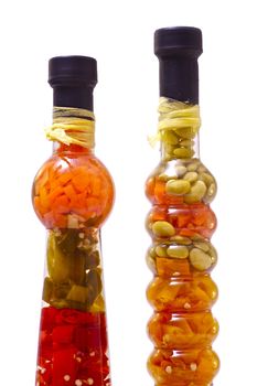 Exotic Spices in Exotic Clear Glass Bottles. Clipped Photo - Solid White Background
