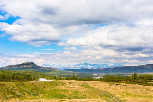 Landscape with mountains and clouds in Rondane, Norway