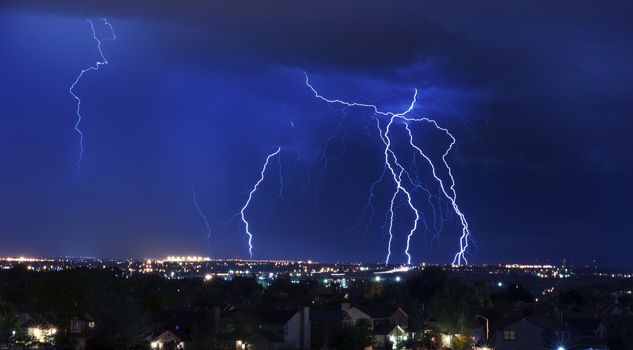 Lightning Storm Over South-West Colorado Springs, Colorado, USA. Overnight Heavy Thunderstorm - City, Storm Cloudscape and Few Lightnings. Powerful Nature Photo.