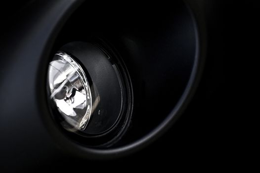 Bumper Halogen Modern Vehicle Lighting. Black Bumper / Black Vehicle Body.  Vehicle Fog Light