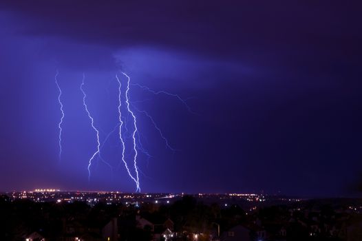 Overnight Lightning Storm. Storm Over City. Few Lightning Strikes. Stormy Overnight Weather in Colorado Springs Metro Area. Horizontal Photo.